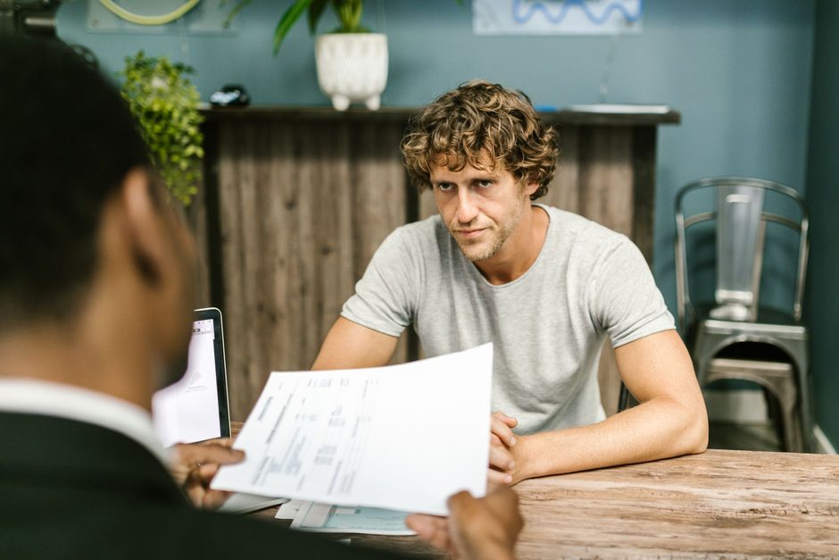 Accountant meeting a client at a desk