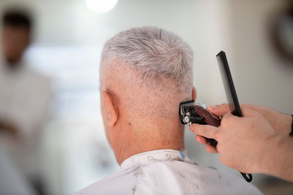Barber cutting a customer’s hair