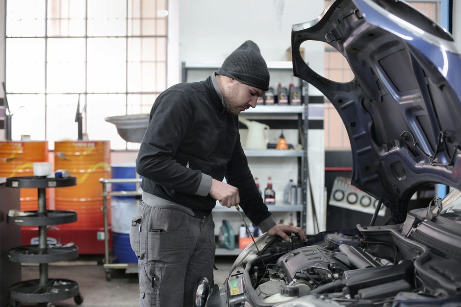 Mechanic working on a car in a garage