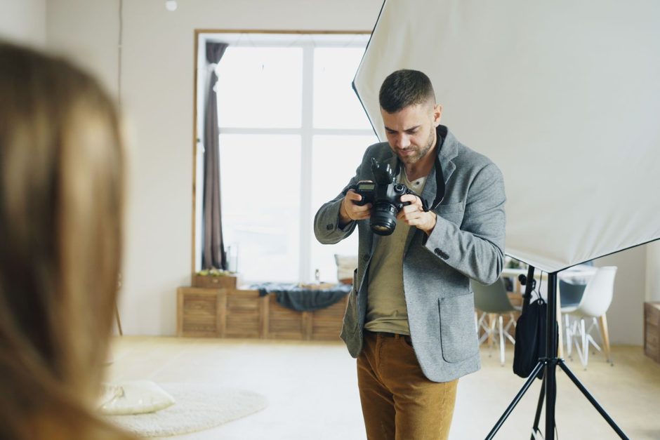 Photographer working with a camera in a studio