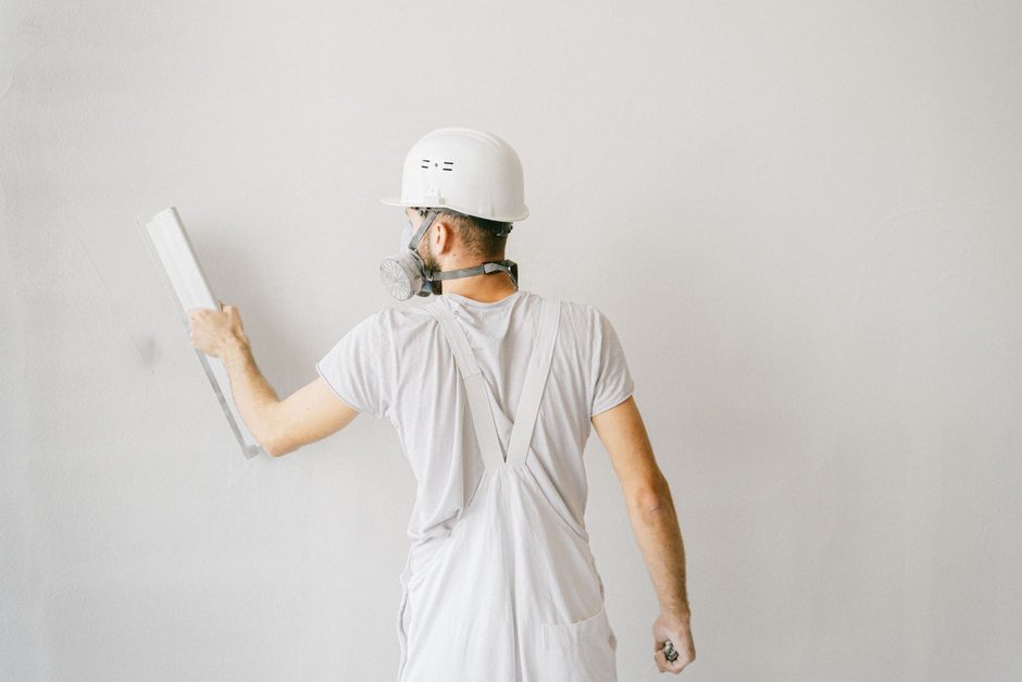 Plasterer skimming an interior wall