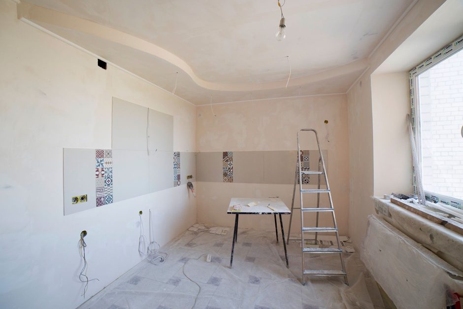 A kitchen part-way through tiling and renovation